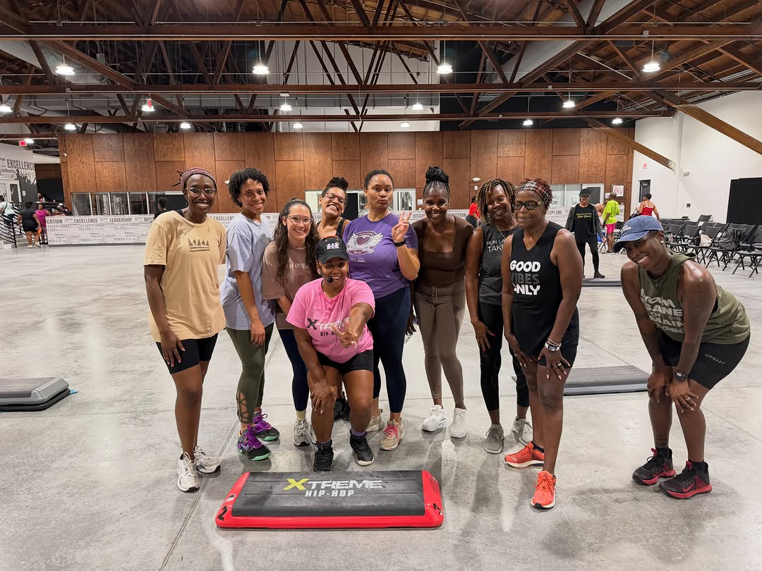 Coach Erika in pink, front and center with House of Step Tampa class members